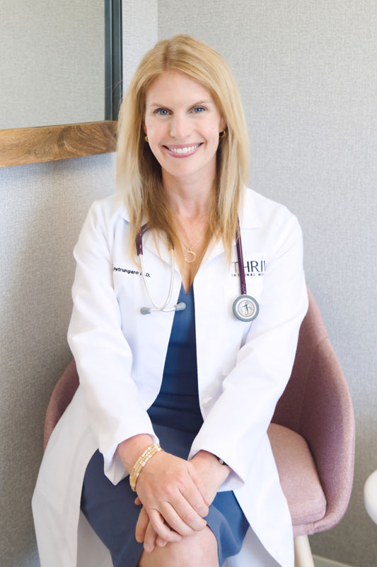 Dr. Kate Petrungaro sitting in a chair